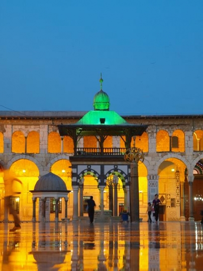 yard of a mosque with reflections on the floor