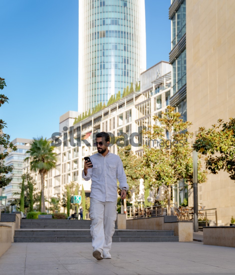 Professional Man Walking Through Al Abdali Boulevard, Amman